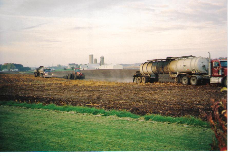 Spreading manure in field
